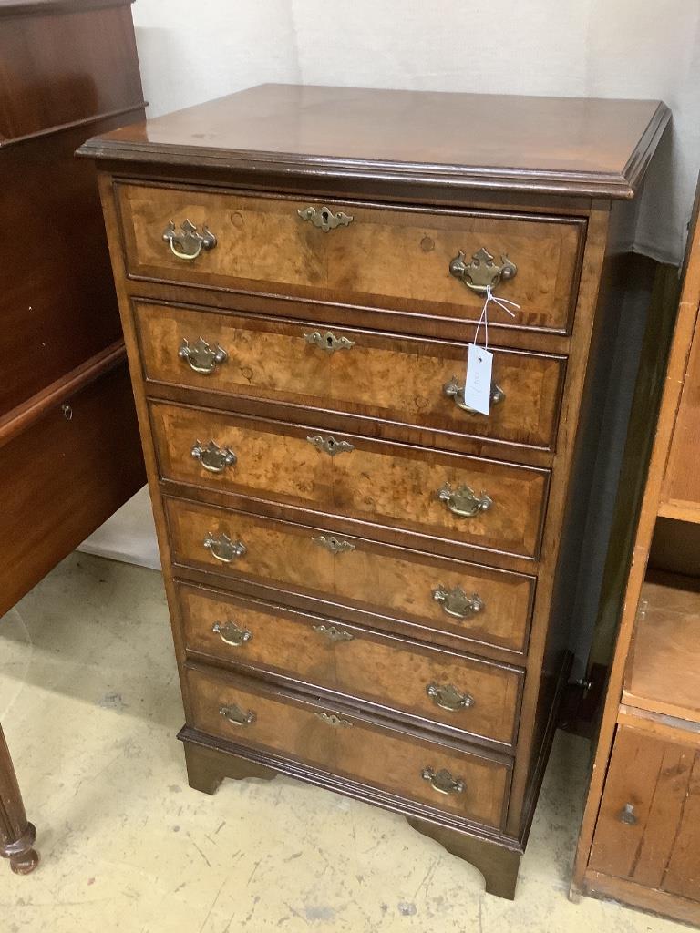 A Queen Anne revival narrow walnut chest, width 59cm, depth 49cm, height 108cm